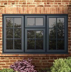 Double pane vinyl casement windows on brick exterior - 1st Capital Certified Roofing Austin TX
